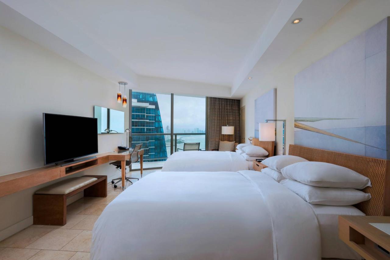 Guest room 2 double beds balcony partial ocean view,1356376349:JPEG