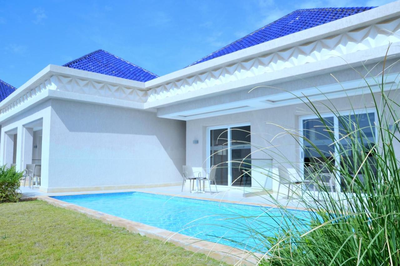 Quarto com Vista Jardim e Piscina Relaxante