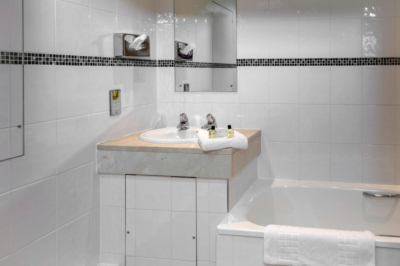 Economy room with double bed and internal window to corridor