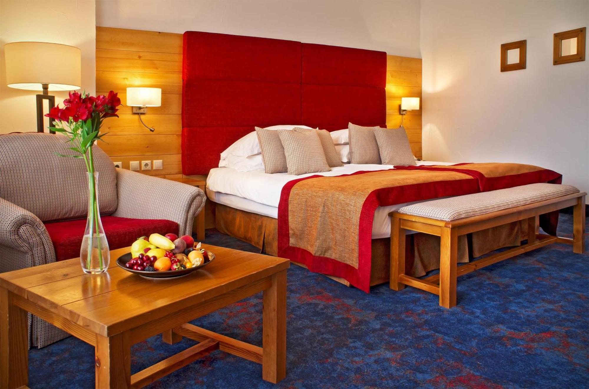Deluxe Zimmer mit Kingsize-Bett und Stadtblick