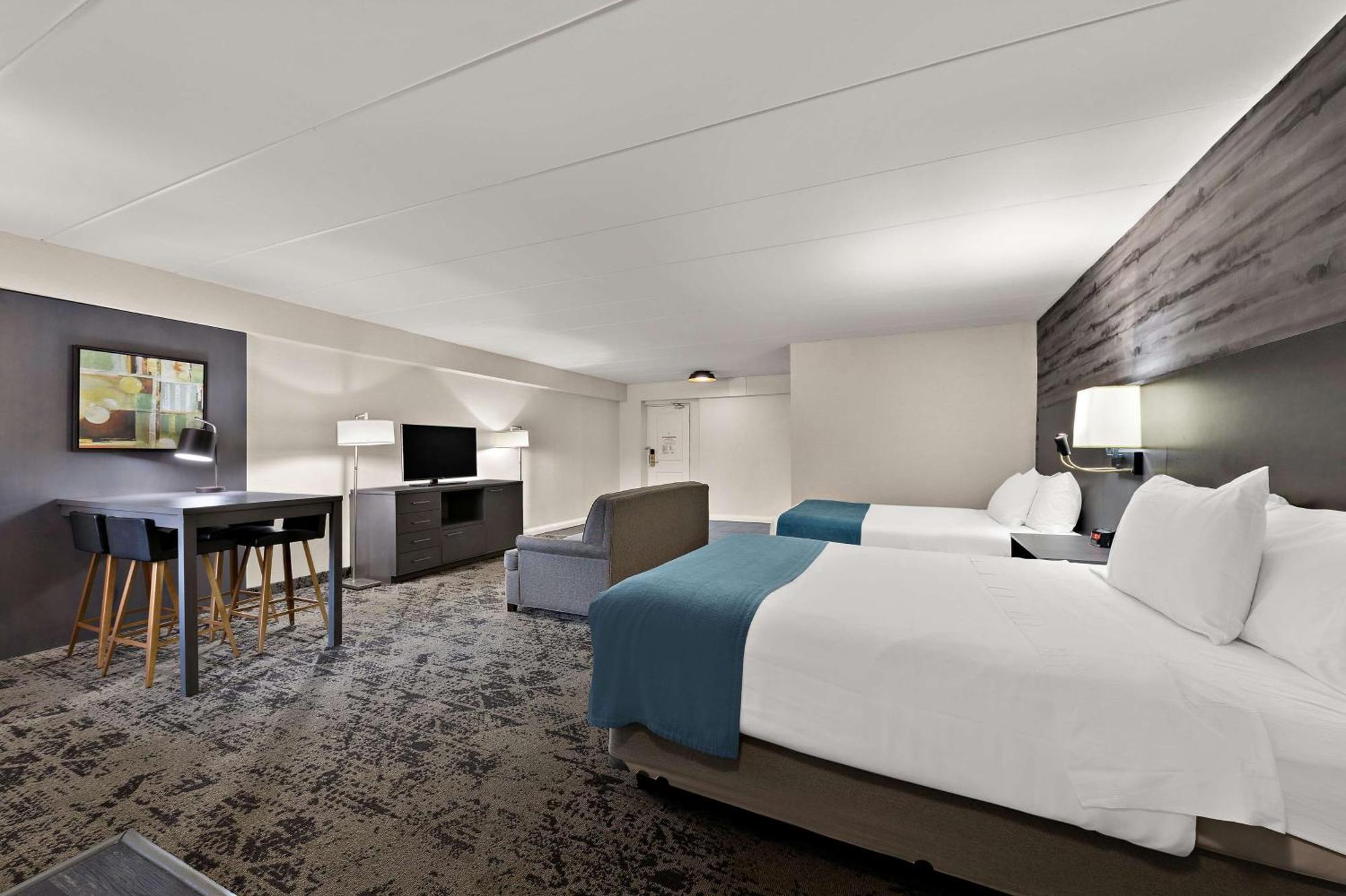 Queen Suite with Two Queen Beds, Sofa Bed, Kitchenette and Walk-In Shower - Non-Smoking