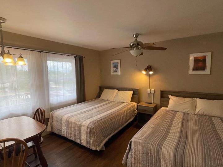 Room with Two Double Beds and Mountain View