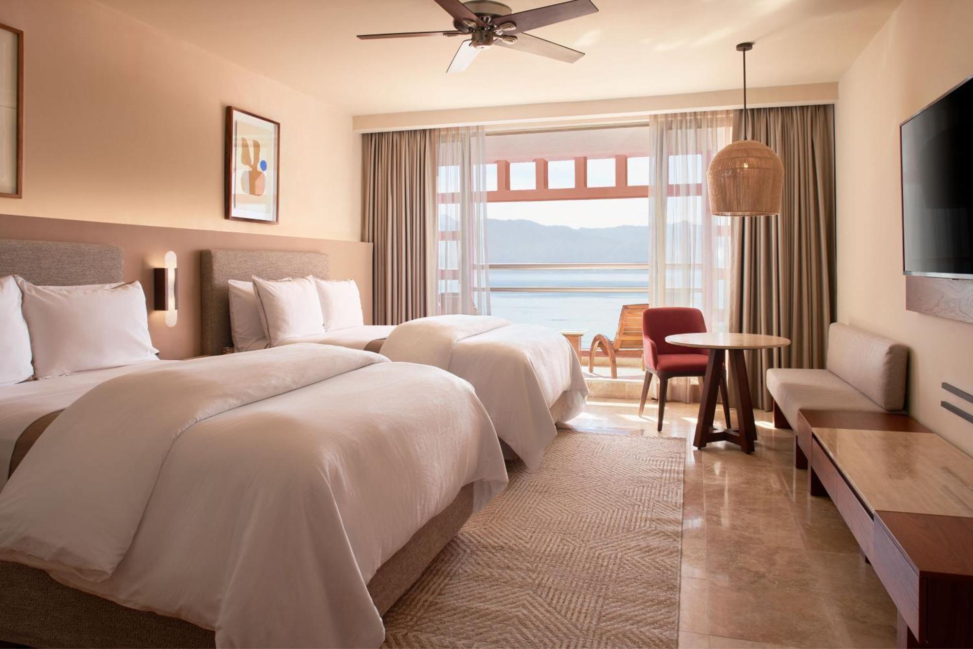 Junior Suite with Two Double Beds and Partial Ocean View
