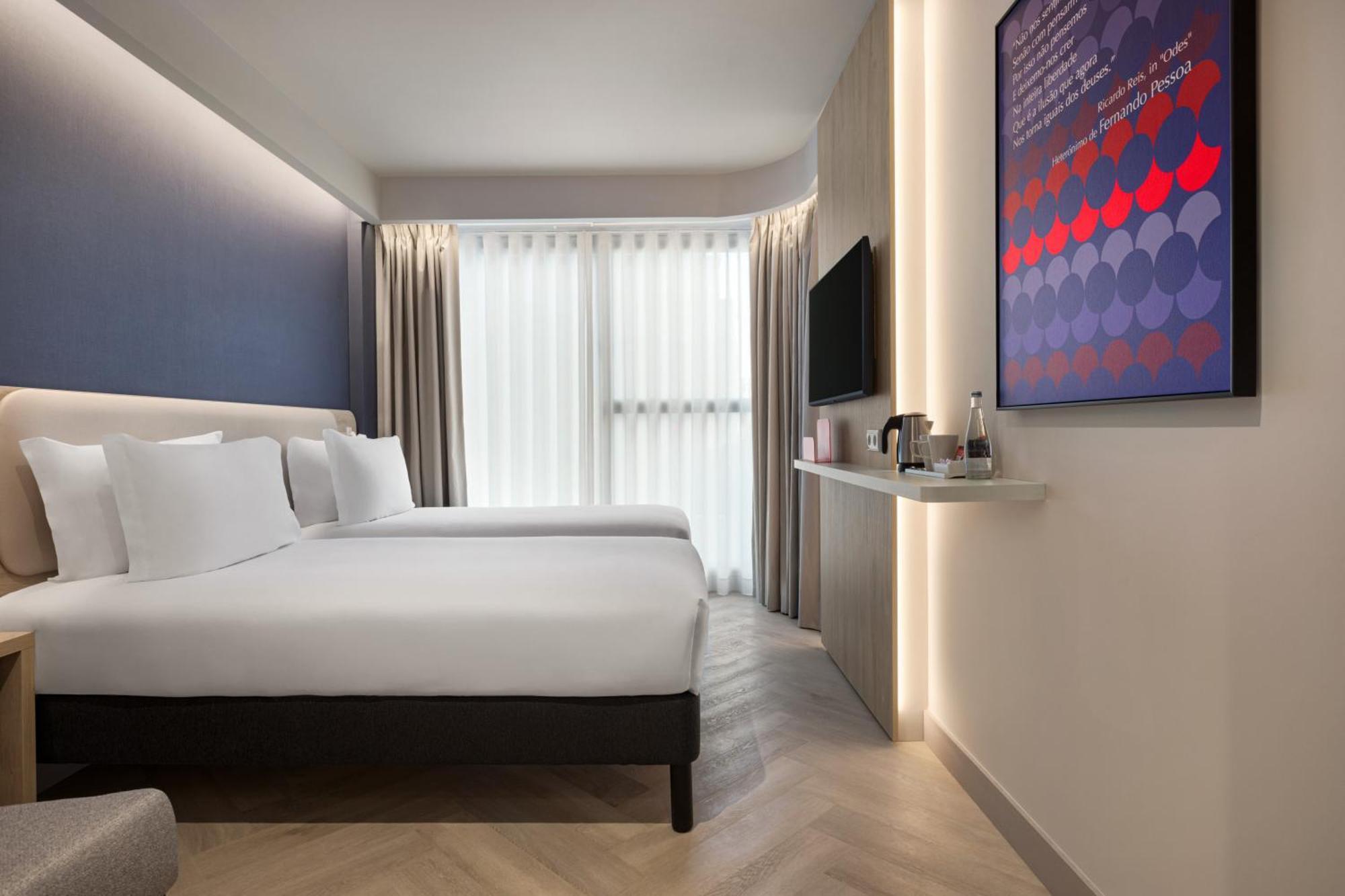 Habitación Doble Estándar con 2 camas individuales y sofá cama