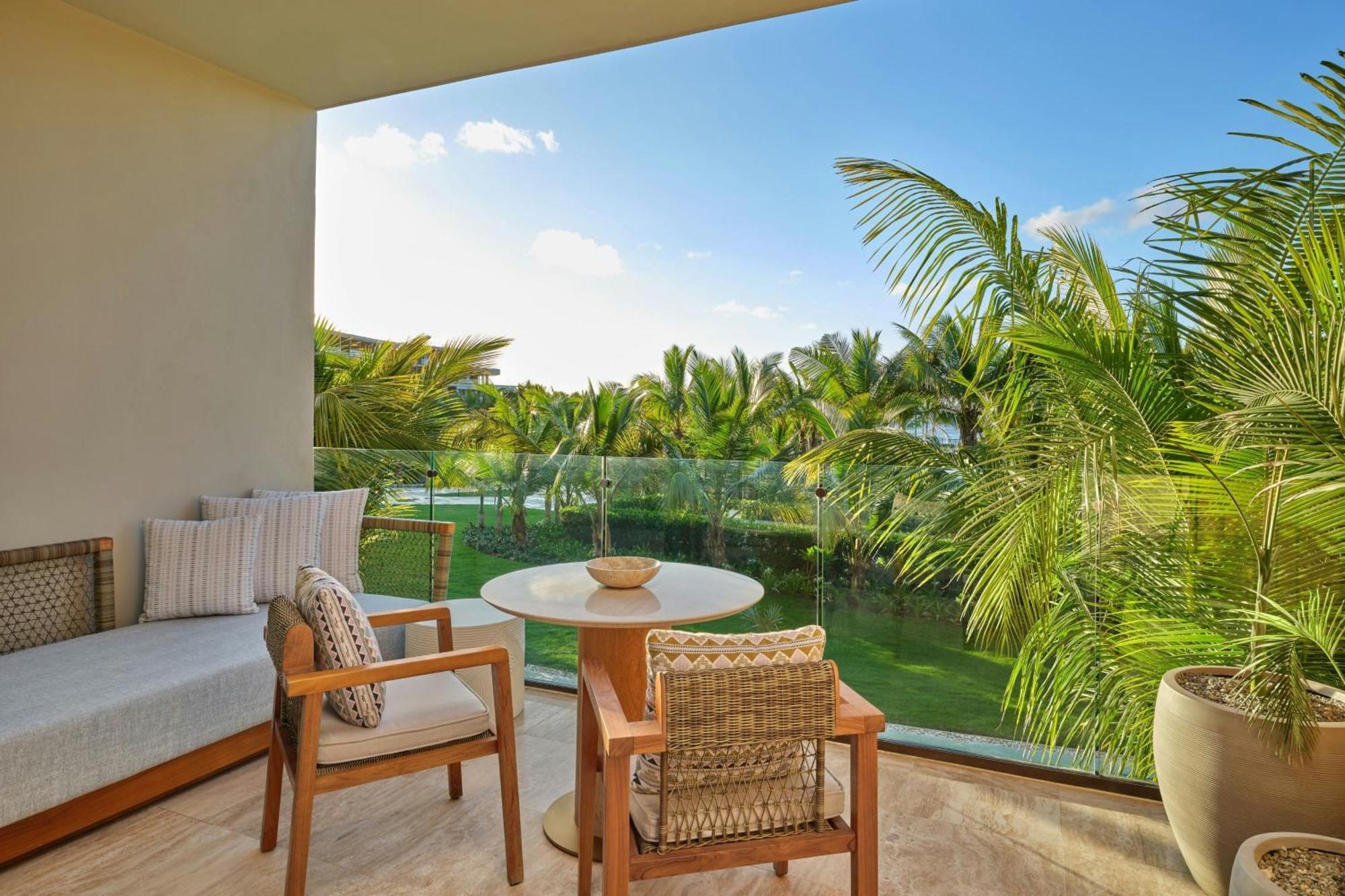 Deluxe King Room with Balcony and Partial Ocean View
