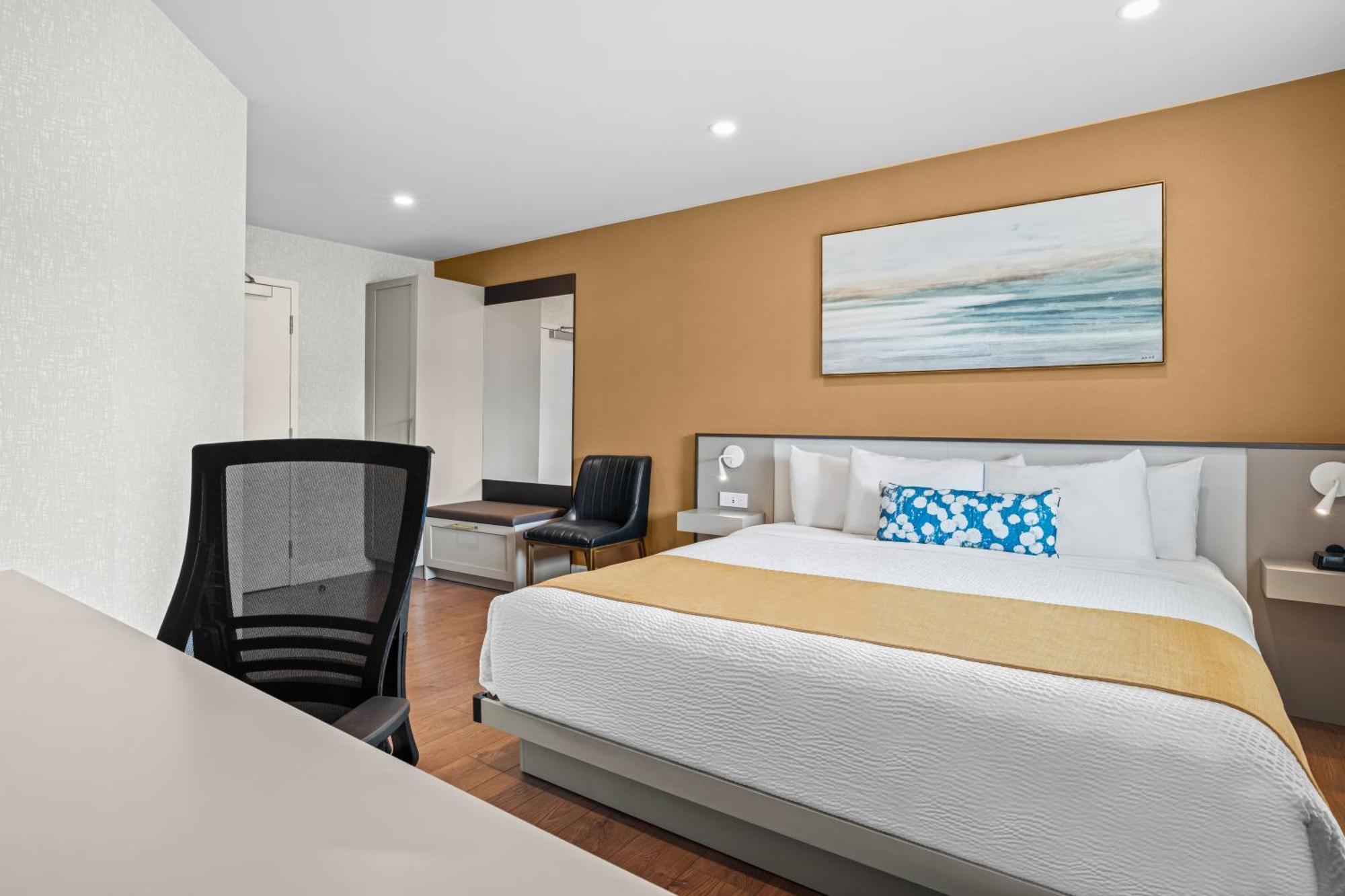 Room with One King Bed and One Queen Murphy Bed, Balcony - Non-Smoking