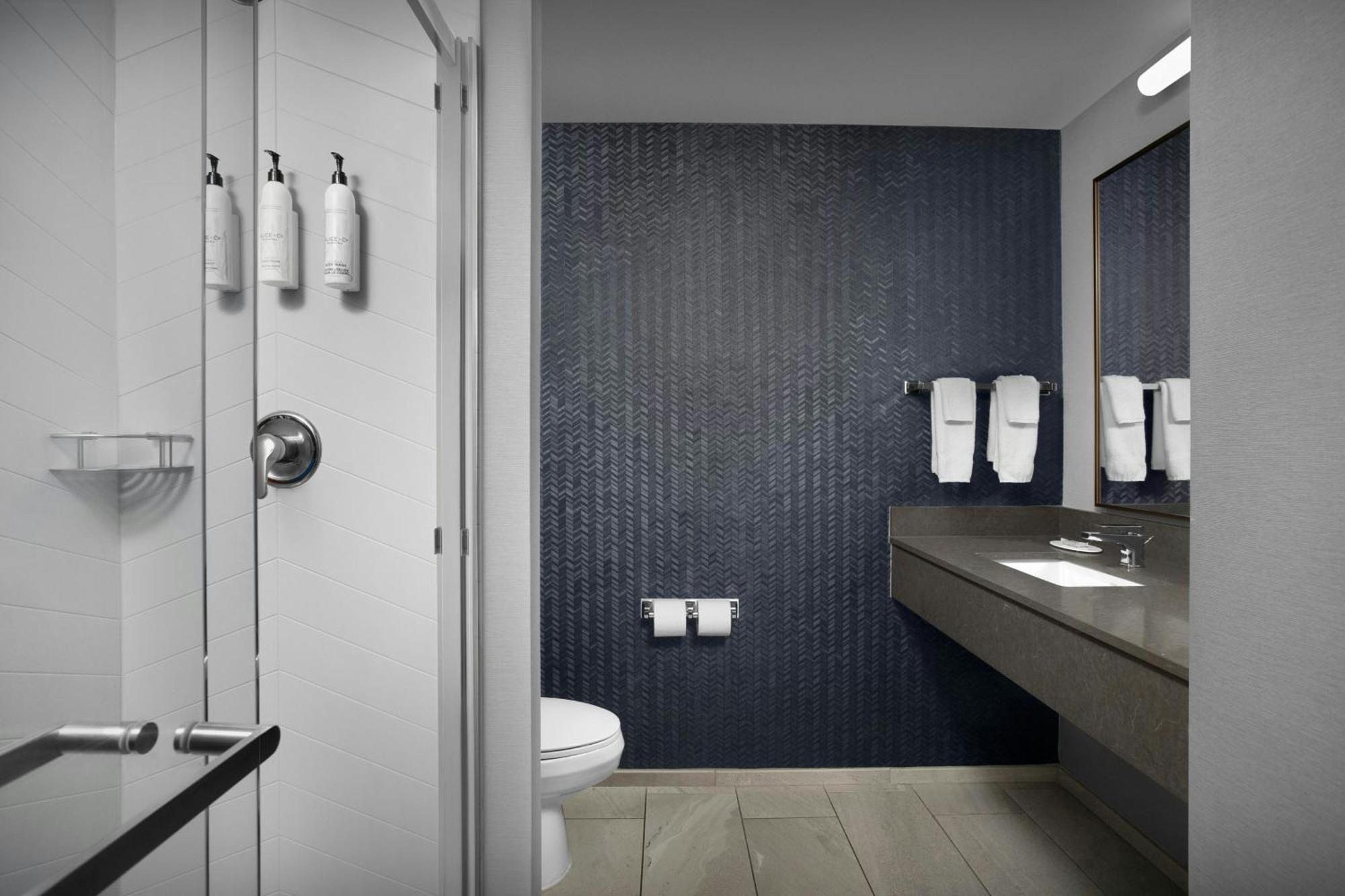 Queen Room Two Queen Beds Roll Shower Mobility Access or Hearing Accessible,1693284703:JPEG