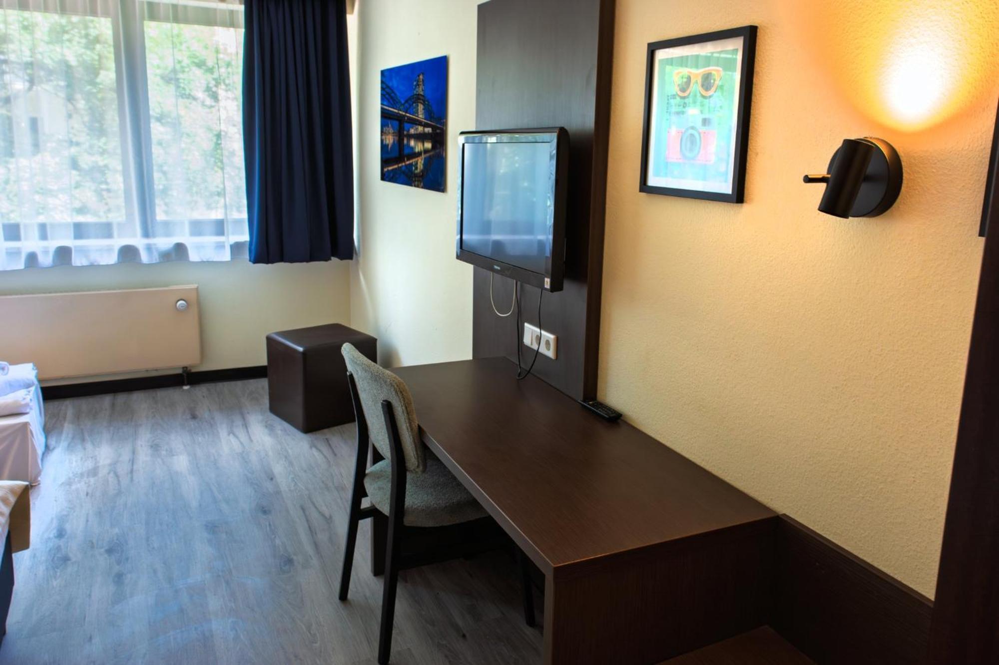 Twin Room with Two Single Beds and Sofa Bed
