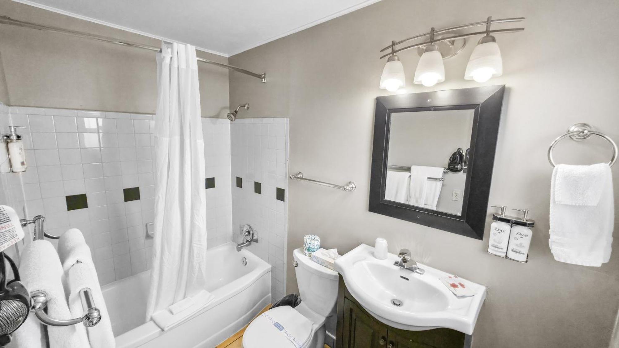 Deluxe Queen Room with Two Queen Beds and sofa