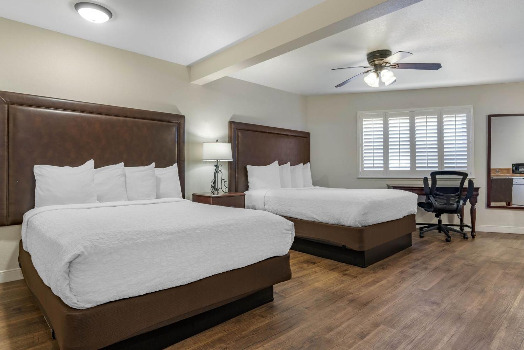 Studio Queen Suite with Two Queen Beds, Sofa Bed, Full Kitchen and Patio - Non-Smoking