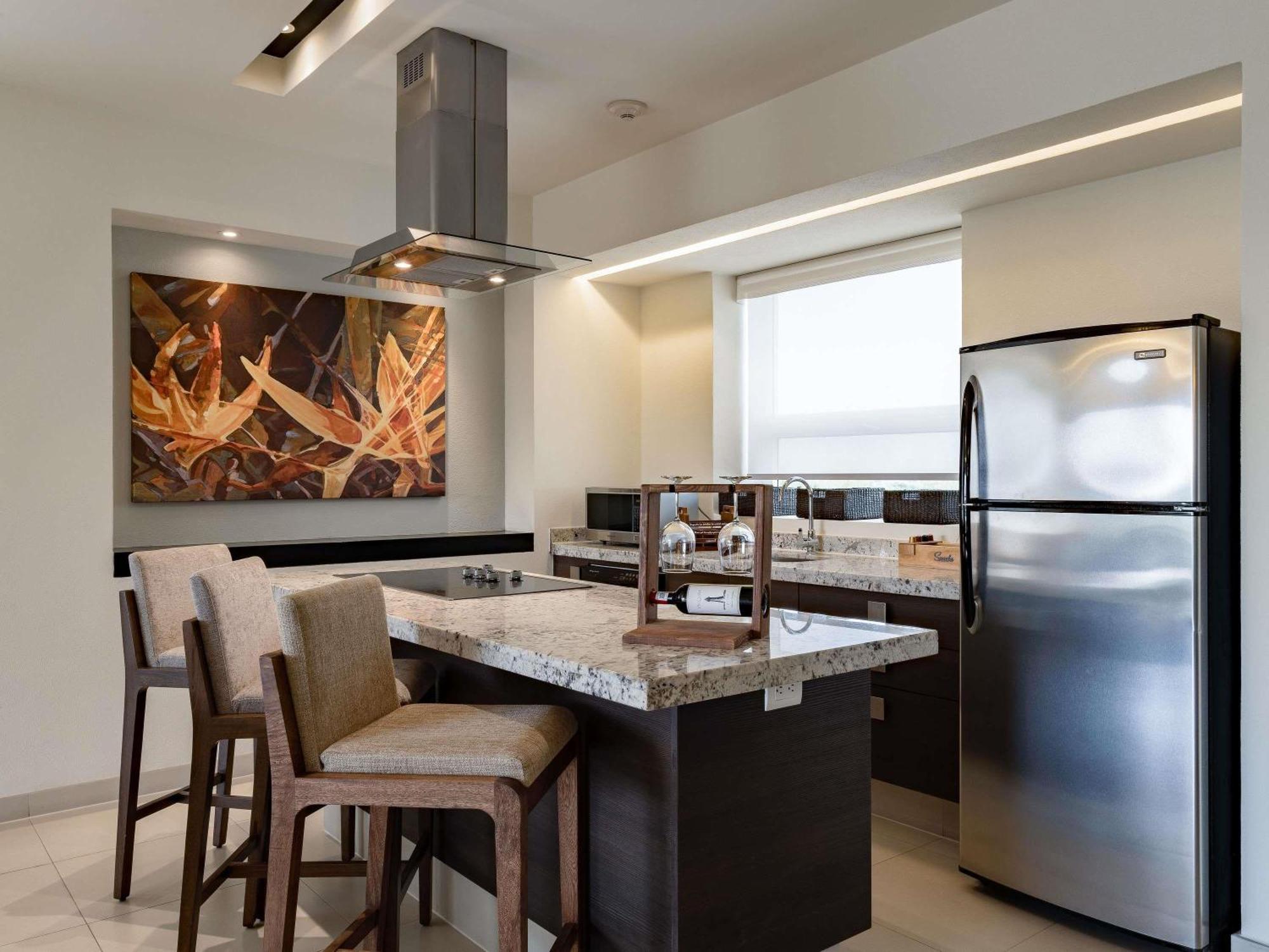 One-Bedroom King Room Balcony or Terrace Kitchen
