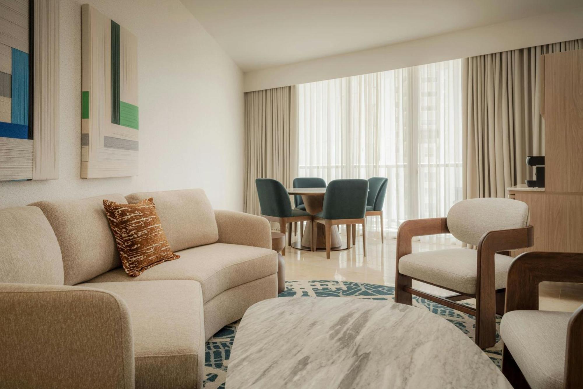 Executive suite king bed balcony partial ocean view