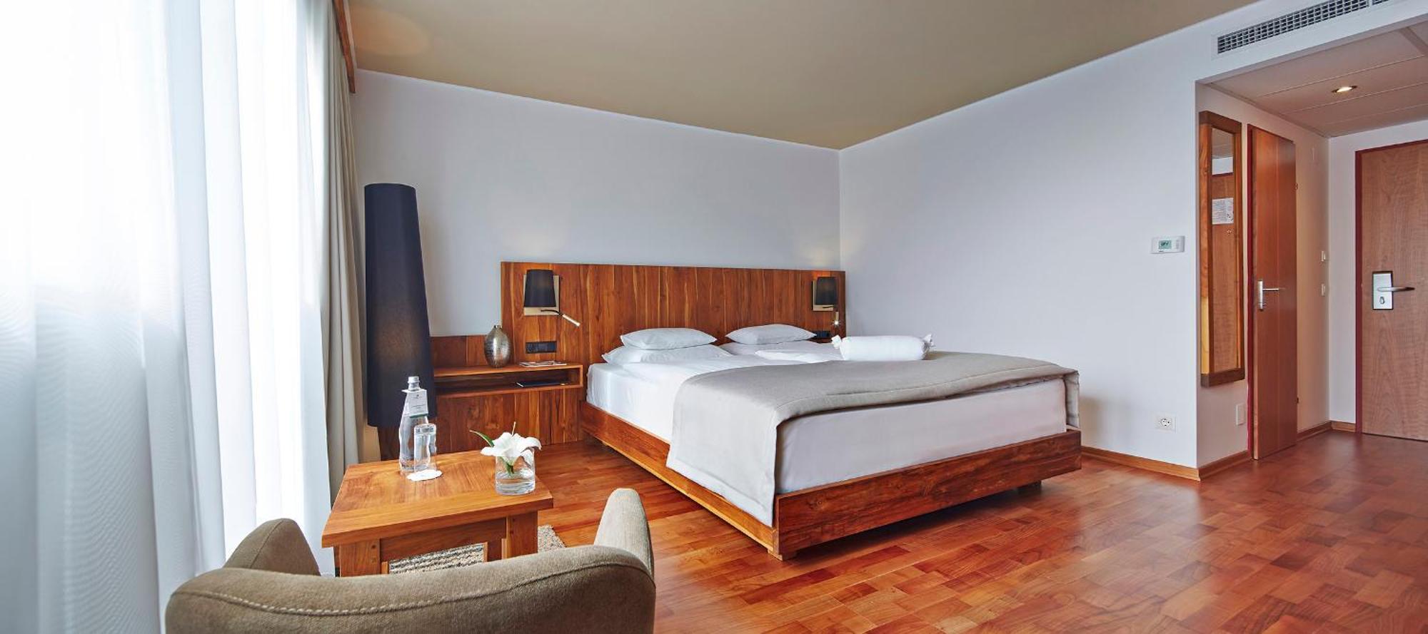 Deluxe Zimmer mit Gartenblick und Balkon